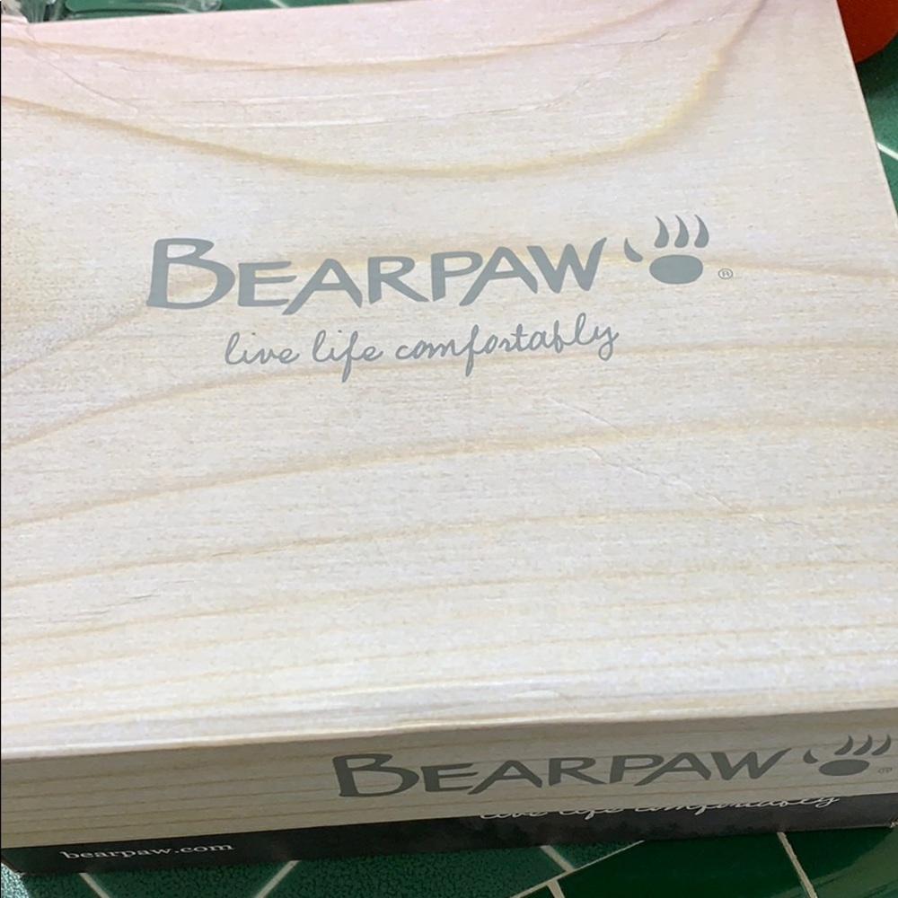 Bearpaw boots burgundy colored.